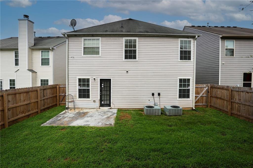 5854 El Segundo Way Atlanta, GA 30349 - Photo 54 of 63 a front view of house with yard
