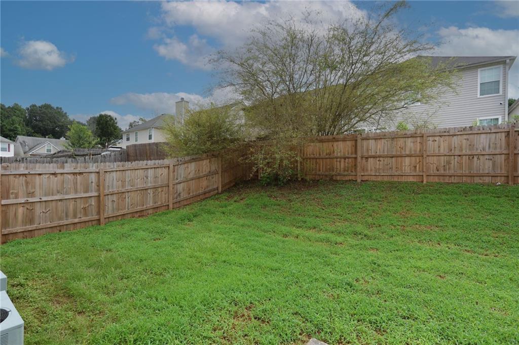 5854 El Segundo Way Atlanta, GA 30349 - Photo 55 of 63 a view of a backyard with a trees