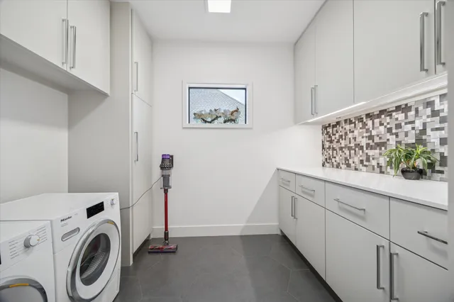a view of storage and utility room with washer and dryer
