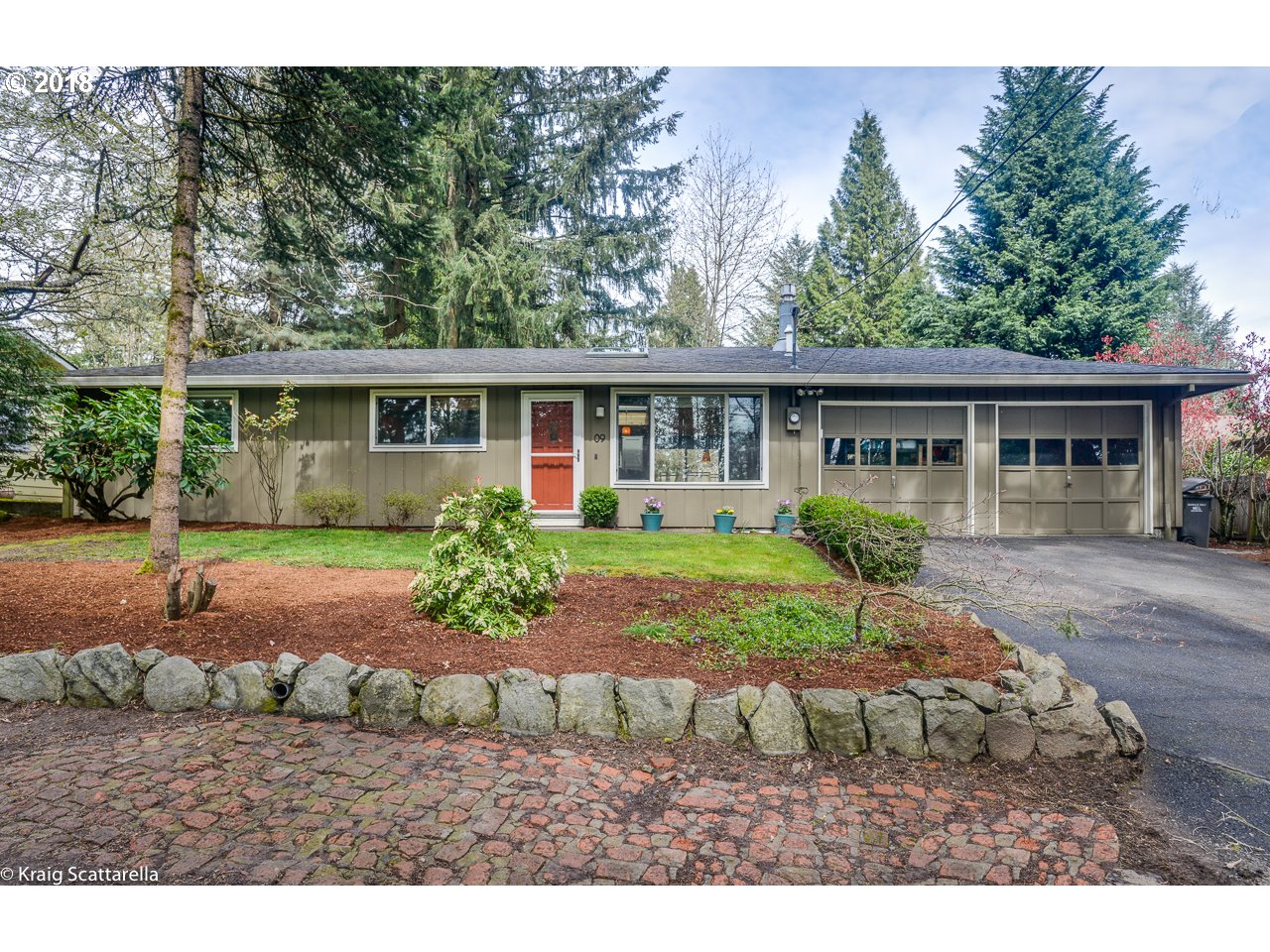 9 Southwest Collins Street Portland, OR 97219 - Photo 1 of 26 a view of front of house with a yard