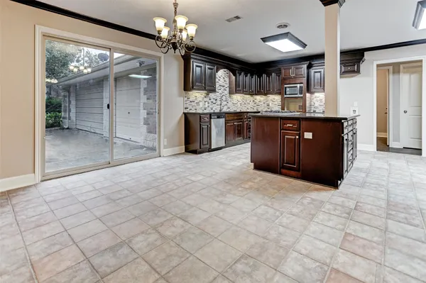 a kitchen with stainless steel appliances granite countertop a cabinets and a counter top space
