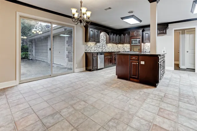 a kitchen with stainless steel appliances granite countertop a cabinets and a counter top space
