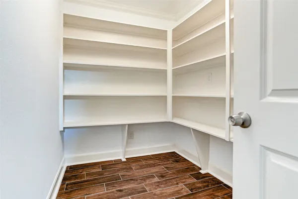 a view of a room with shelf on the wall