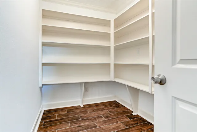 a view of a room with shelf on the wall