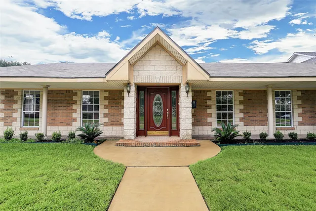 a front view of a house with garden