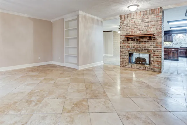 an empty room with a fireplace