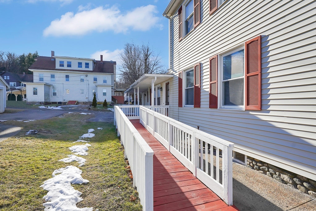 2022 Maple Street Three Rivers, MA 01080 - Photo 2 of 42 a view of a house with backyard and deck