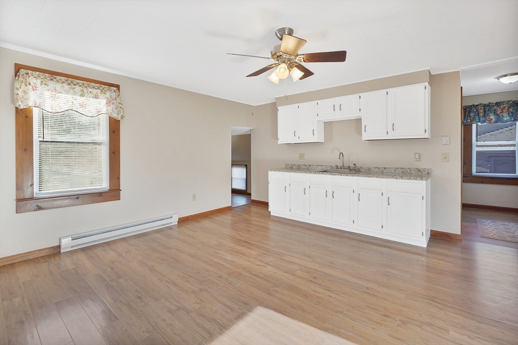 2022 Maple Street Three Rivers, MA 01080 - Photo 33 of 42 a view of a kitchen cabinets a sink and a window