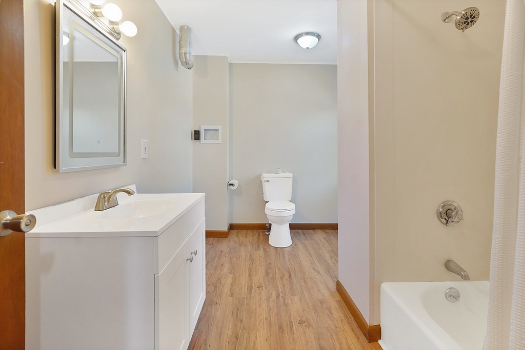 2022 Maple Street Three Rivers, MA 01080 - Photo 34 of 42 a bathroom with a sink a toilet and shower