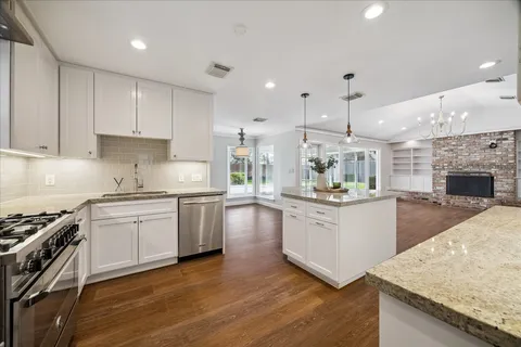 a view of an entryway with wooden floor