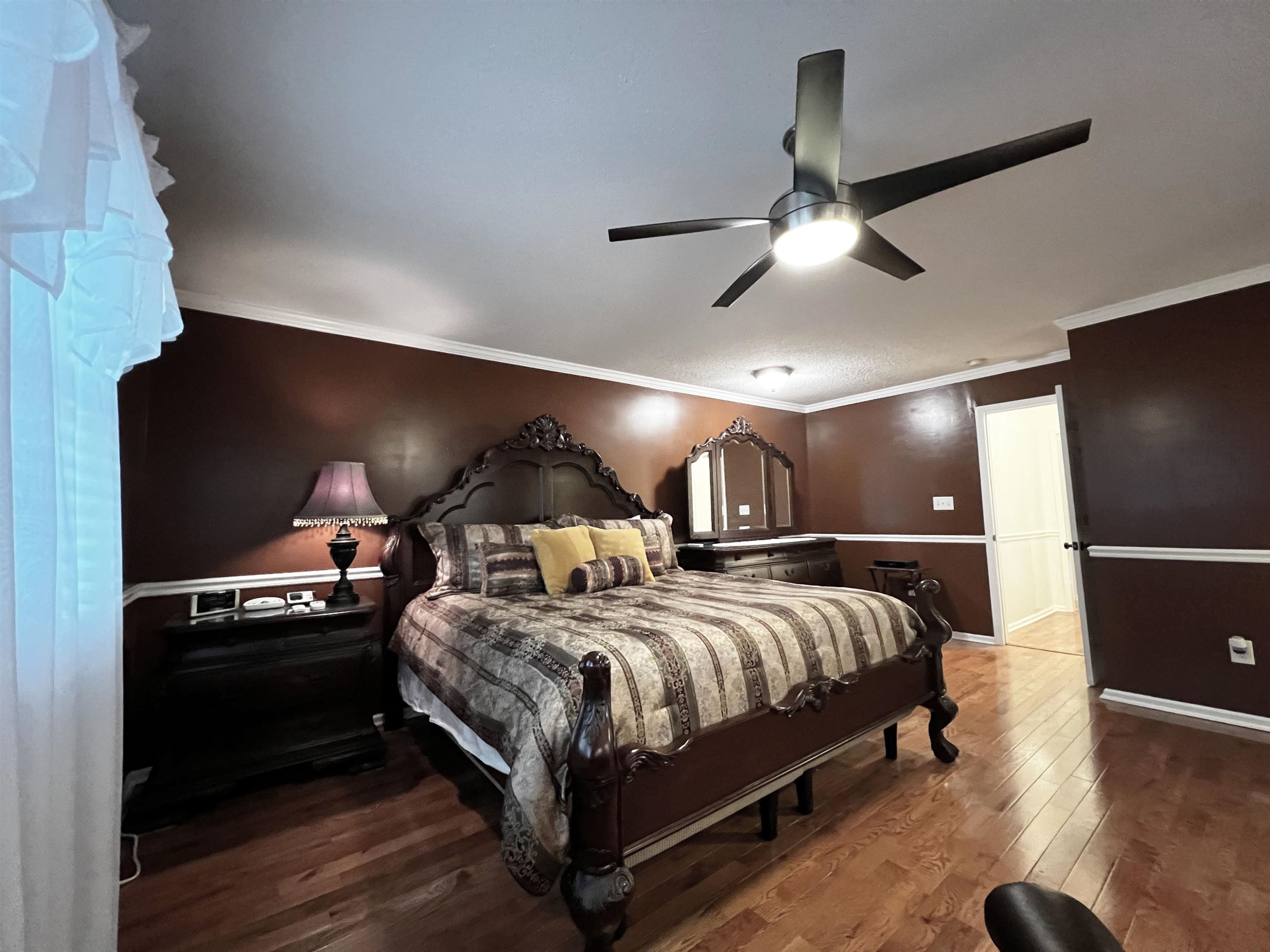 424 Eugene Street Durham, NC 27701 - Photo 13 of 26 a bedroom with a bed and a ceiling fan