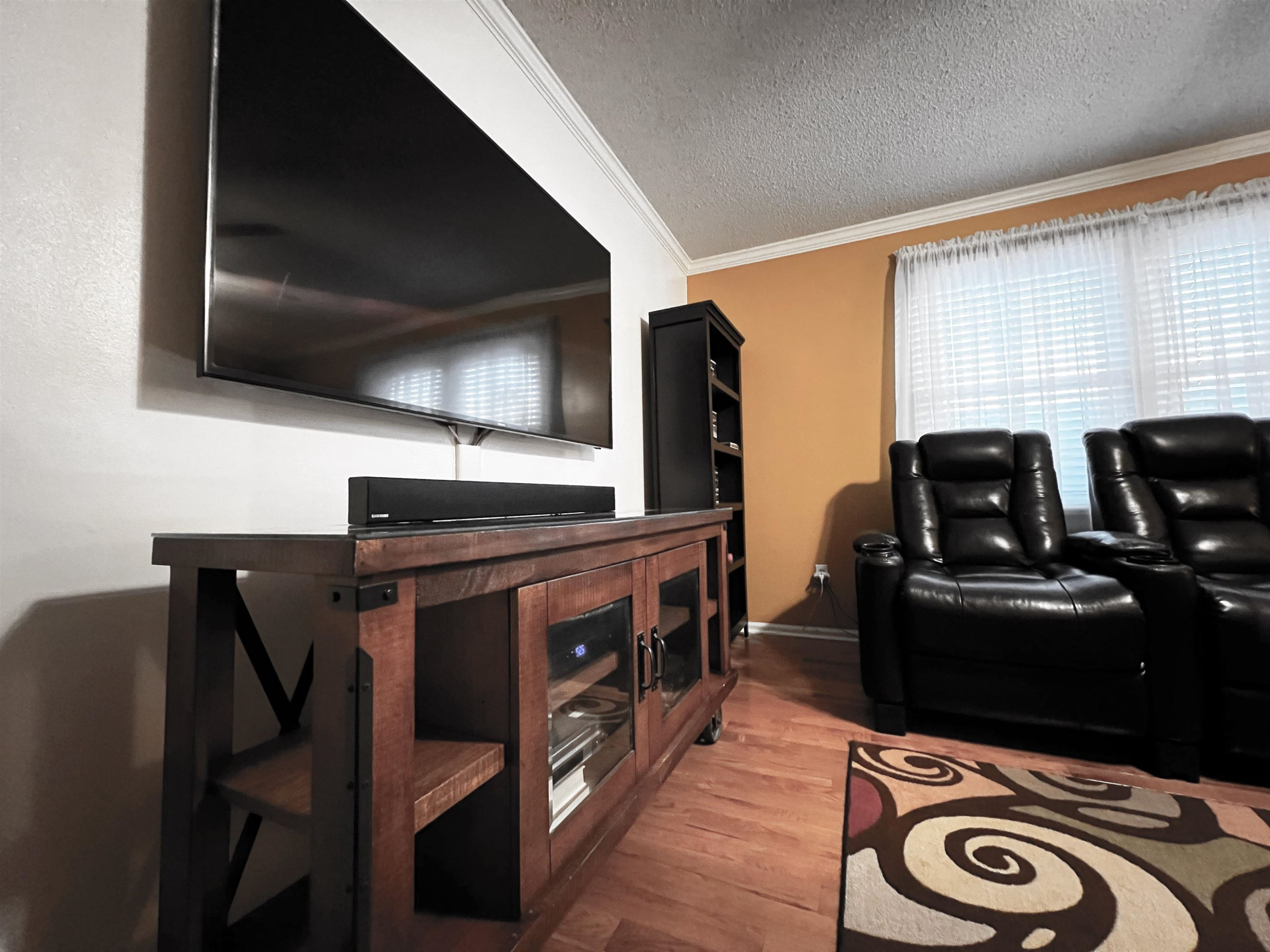 424 Eugene Street Durham, NC 27701 - Photo 18 of 26 a kitchen with stainless steel appliances kitchen island granite countertop a stove and a microwave