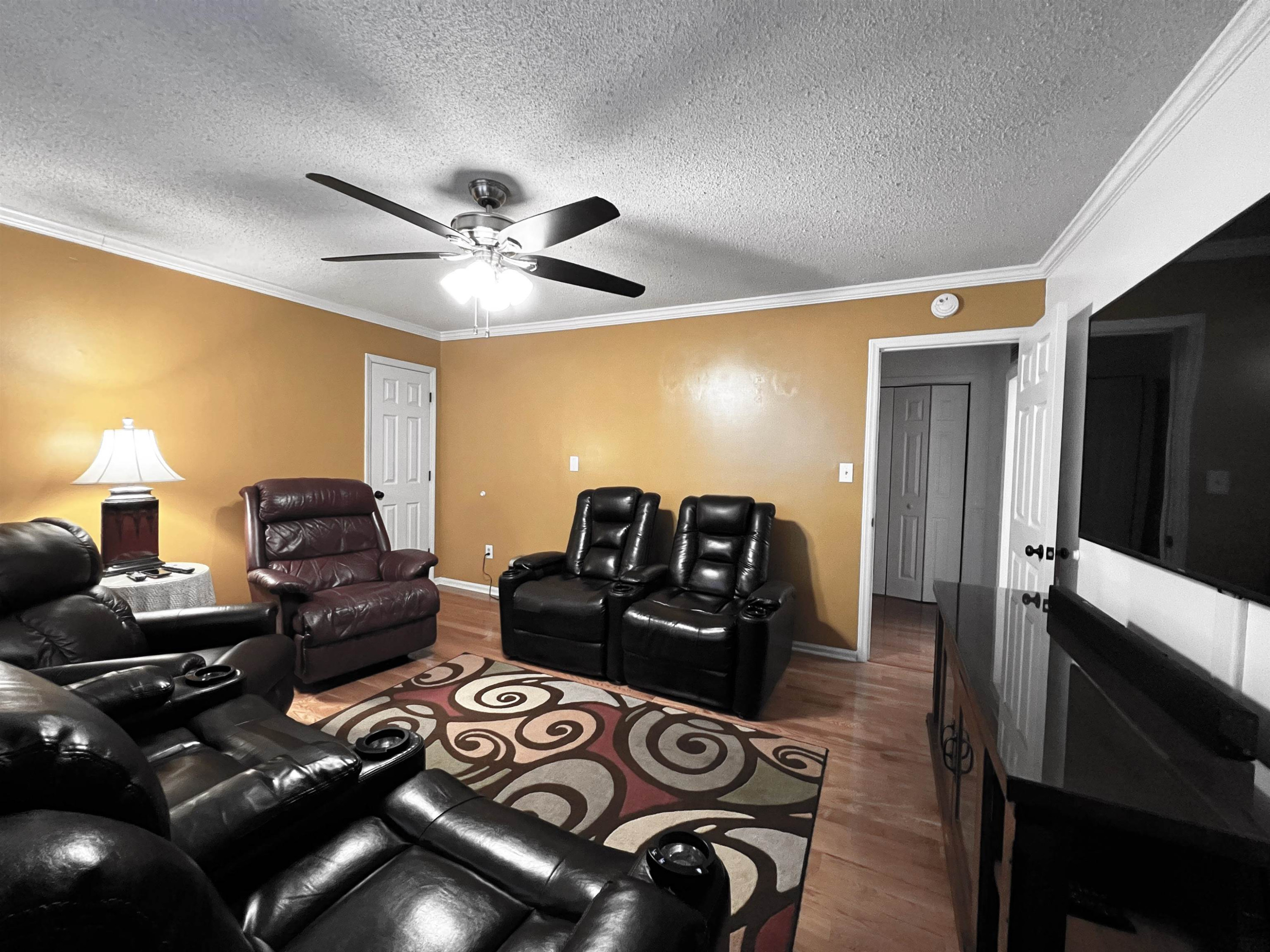 424 Eugene Street Durham, NC 27701 - Photo 19 of 26 a living room with furniture and a flat screen tv
