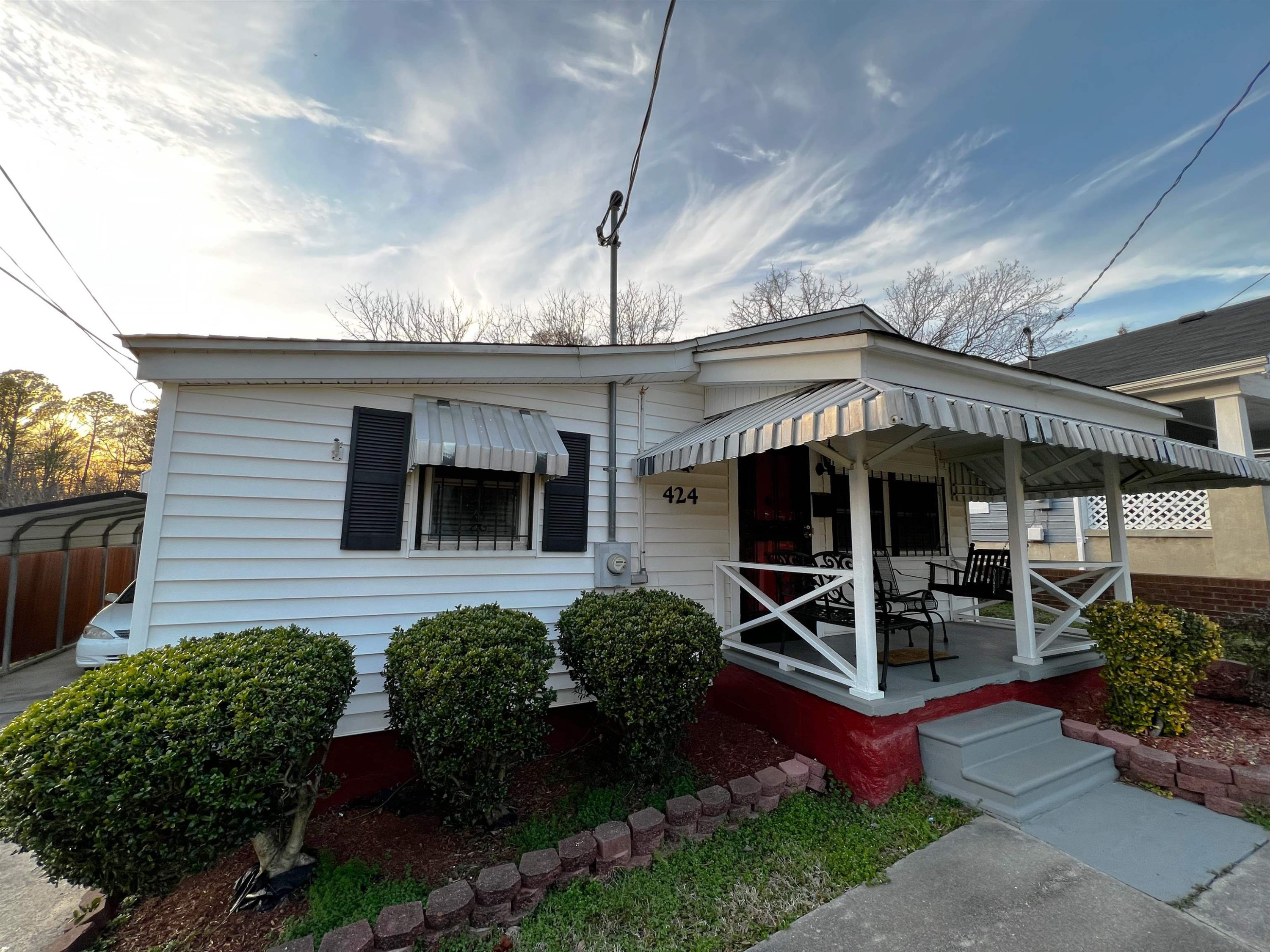 424 Eugene Street Durham, NC 27701 - Photo 3 of 26 a front view of a house with garden