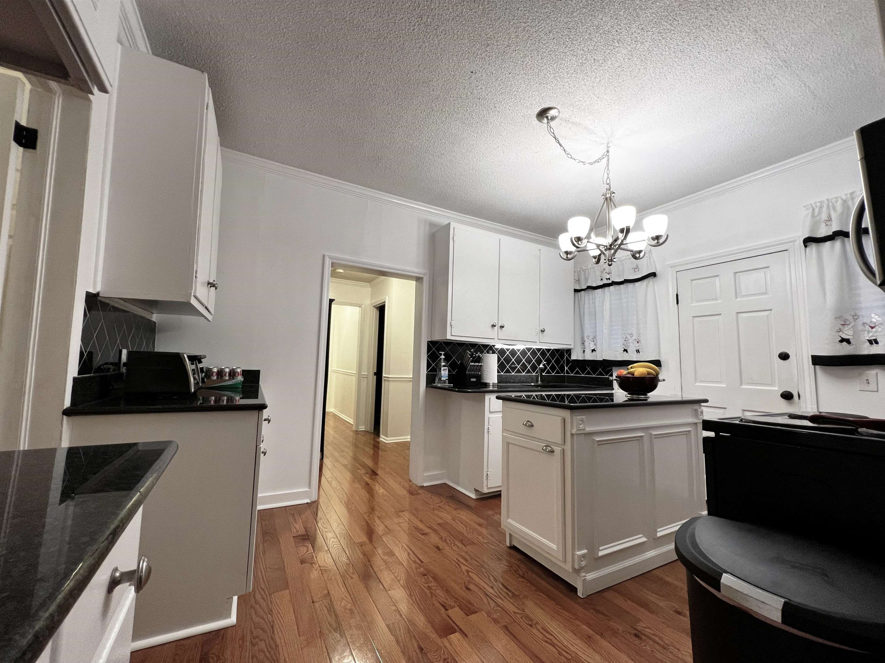 424 Eugene Street Durham, NC 27701 - Photo 8 of 26 a kitchen with stainless steel appliances a sink stove and refrigerator