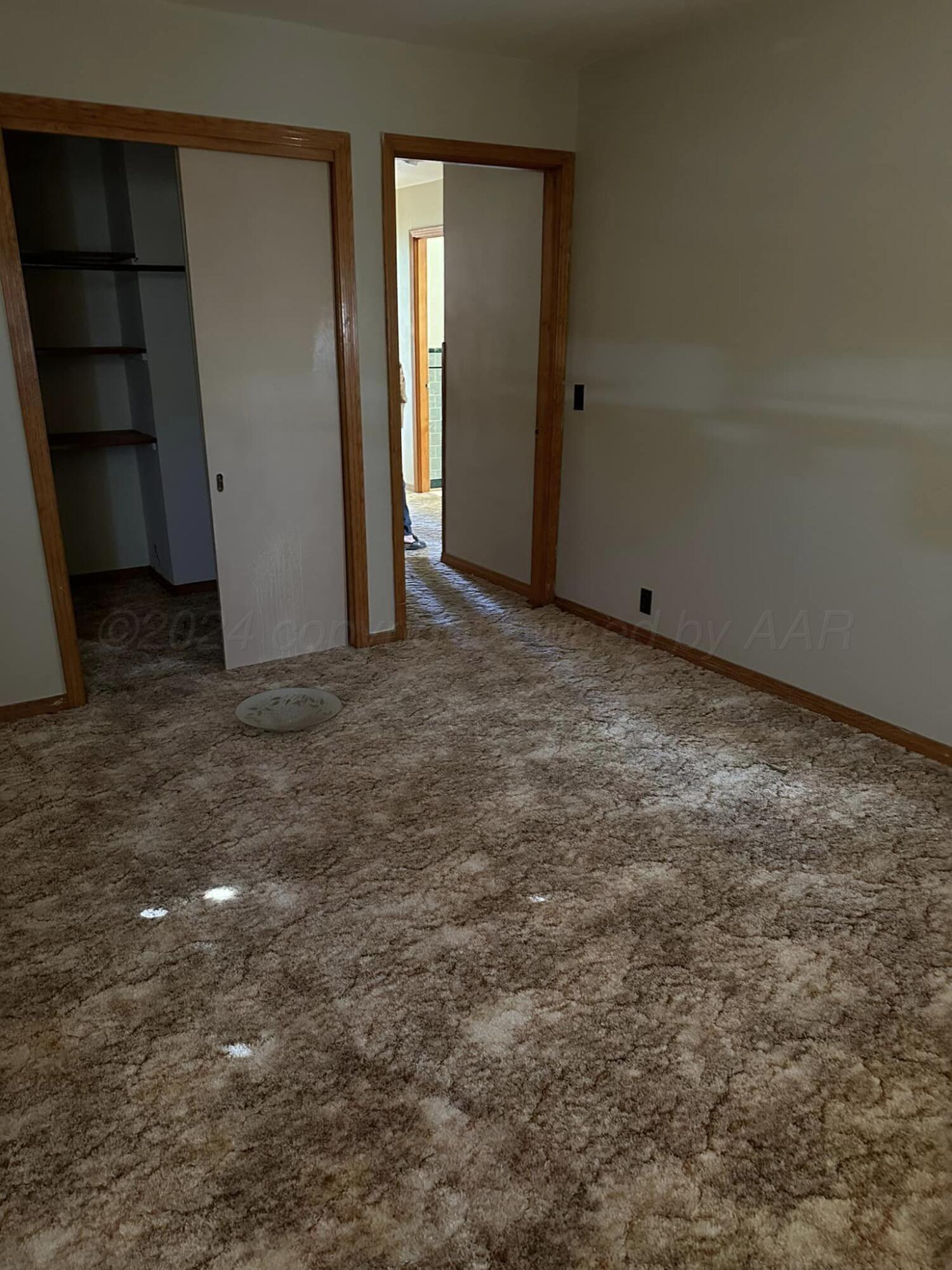 506 Ave O Sunray, TX 79086 - Photo 12 of 18 a view of a room with closet area