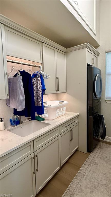 15536 Monterosso Lane, Unit 201 Naples, FL 34110 - Photo 17 of 29 a view of walk in closet with clothes and shoes