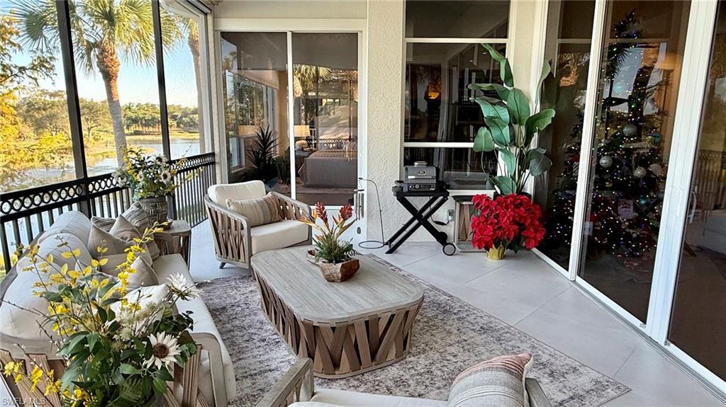 15536 Monterosso Lane, Unit 201 Naples, FL 34110 - Photo 21 of 29 a living room with furniture