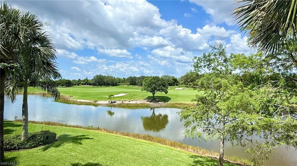 15536 Monterosso Lane, Unit 201 Naples, FL 34110 - Photo 27 of 29 a view of a lake from a yard