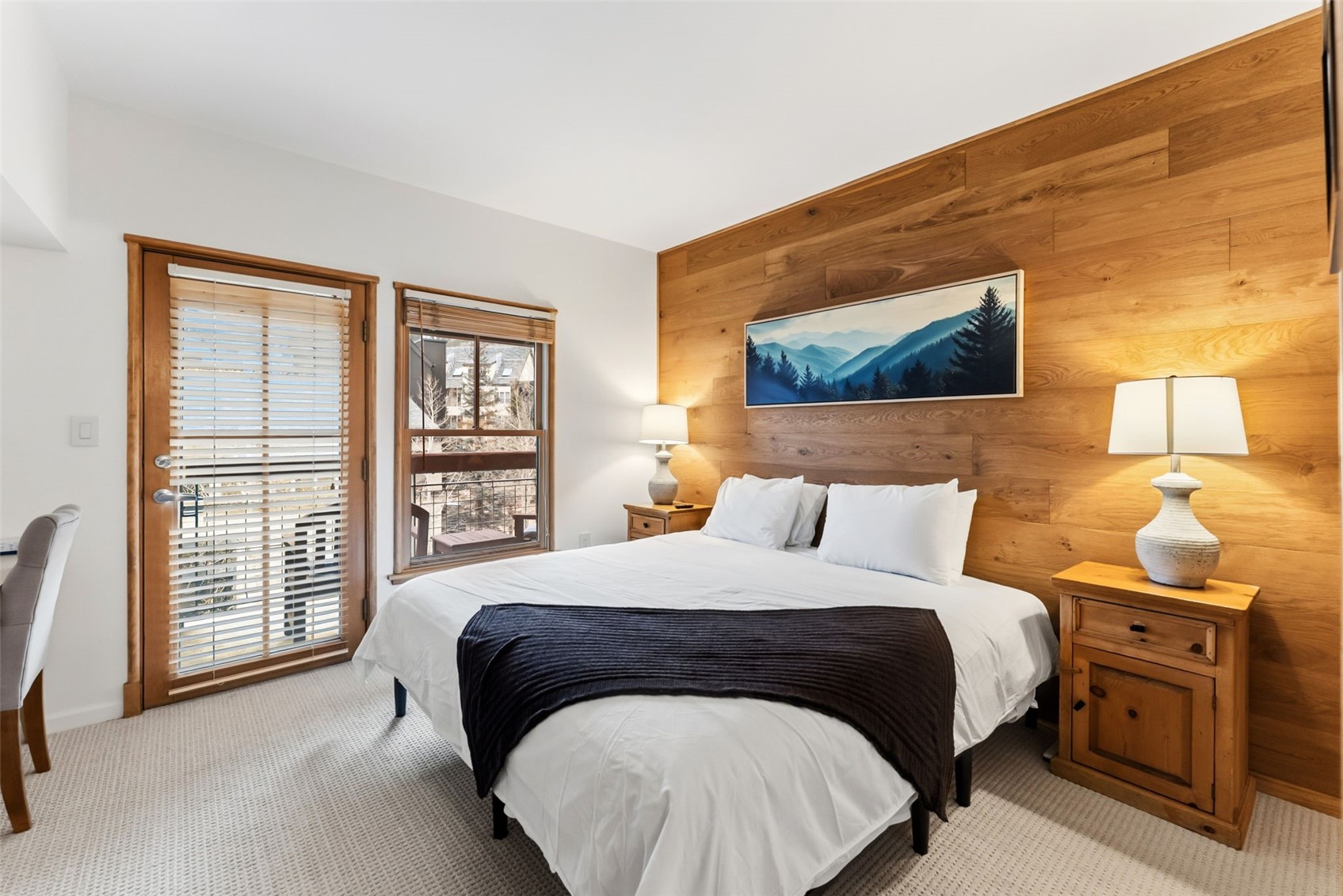 195 River Run Road, Unit 8015 Keystone, CO 80435 - Photo 16 of 35 a bedroom with a bed and wooden floor