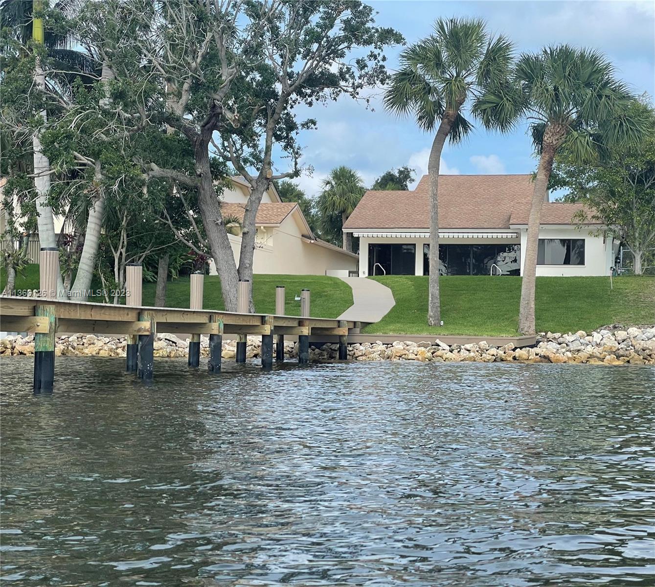 150 Harbourside Circle Jupiter, FL 33477 - Photo 42 of 61 a view of a house with a garden