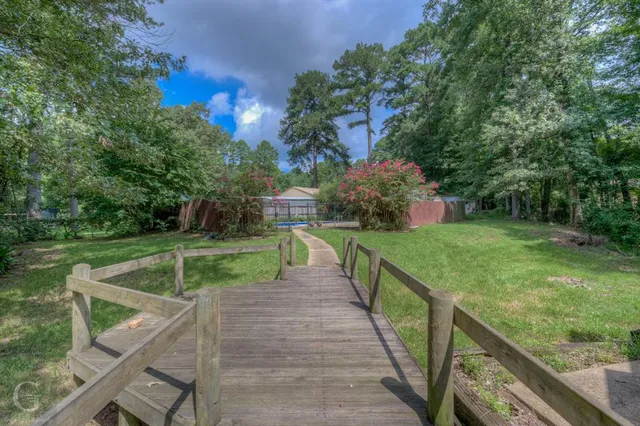 a view of a deck with a yard