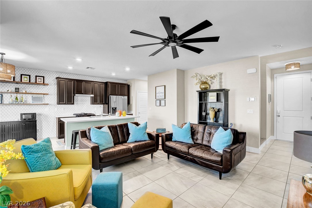 9688 Rankin Rdg Court Las Vegas, NV 89178 - Photo 6 of 53 An open concept living area connects seamlessly with a contemporary kitchen.
