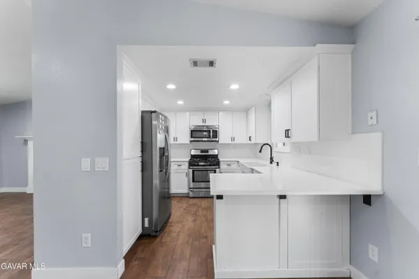 a view of kitchen with wooden floor