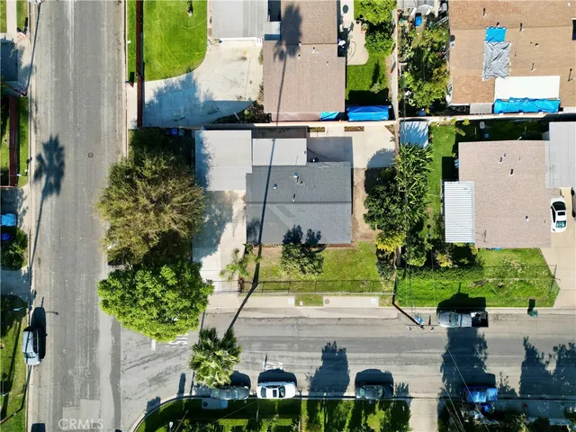 an aerial view of a house with a garden and plants