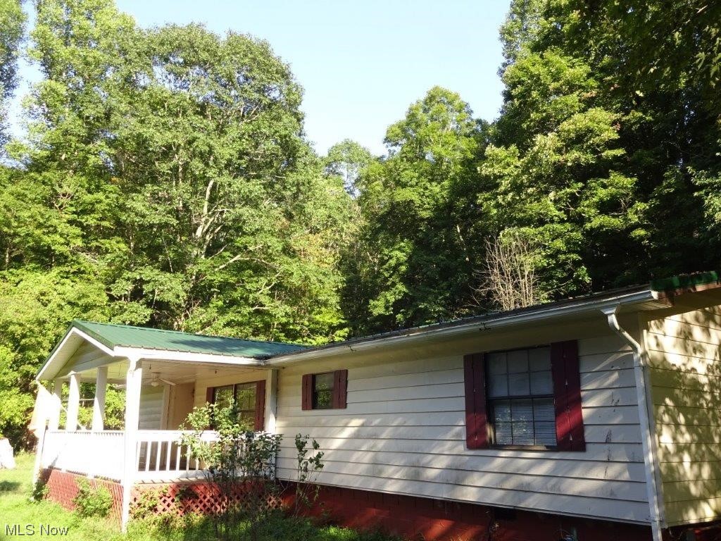 61 Milhoan Road Reedy, WV 25270 - Photo 10 of 26 Ranch-style home featuring a porch