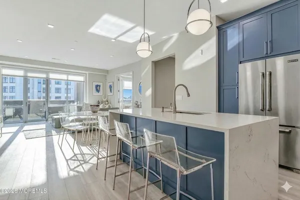 a large kitchen with a table and chairs