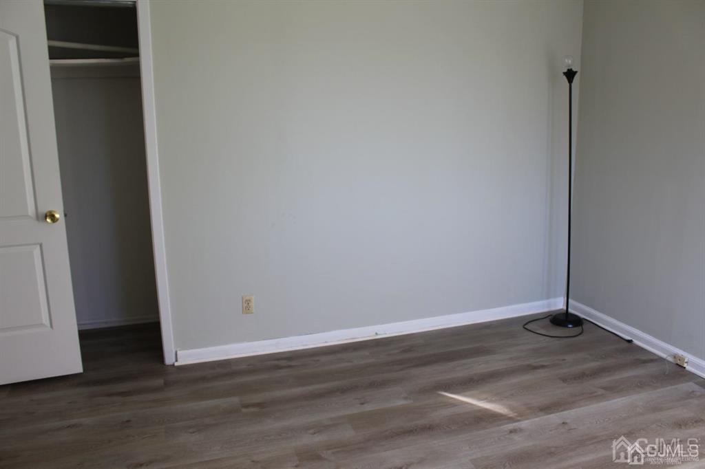 8 Maple Road Iselin, NJ 08830 - Photo 13 of 21 a view of a room with wooden floor