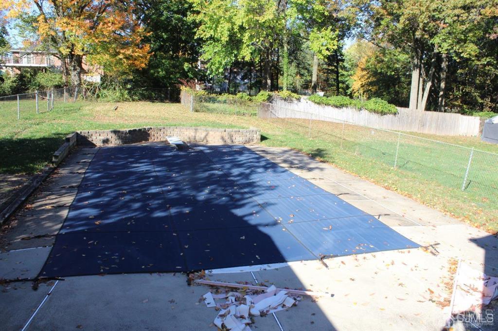 8 Maple Road Iselin, NJ 08830 - Photo 21 of 21 a view of a yard with an outdoor space