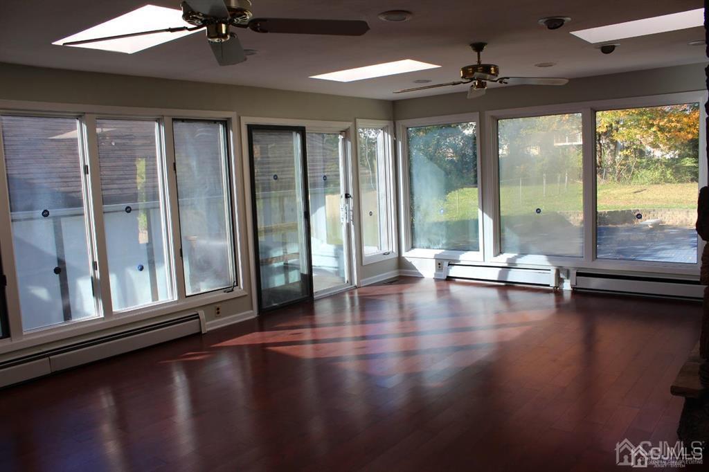 8 Maple Road Iselin, NJ 08830 - Photo 10 of 21 a view of an empty room with window
