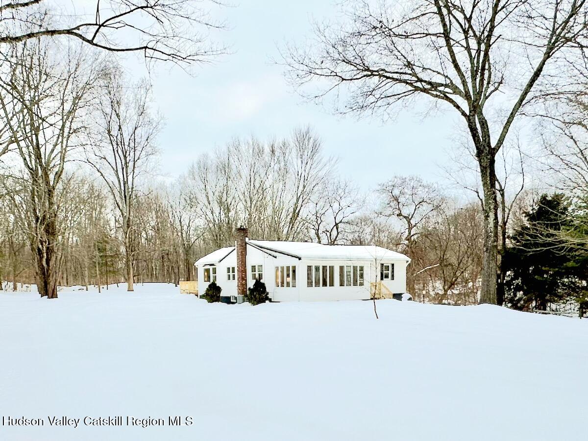 132 Weeds Mill Road Highland, NY 12528 - Photo 1 of 37 a white house that has a tree in front of it