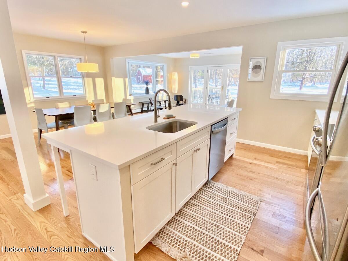 132 Weeds Mill Road Highland, NY 12528 - Photo 11 of 37 a large white kitchen with sink and windows
