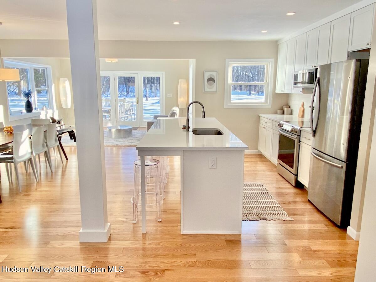 132 Weeds Mill Road Highland, NY 12528 - Photo 12 of 37 a kitchen with stainless steel appliances granite countertop a refrigerator a stove and a sink