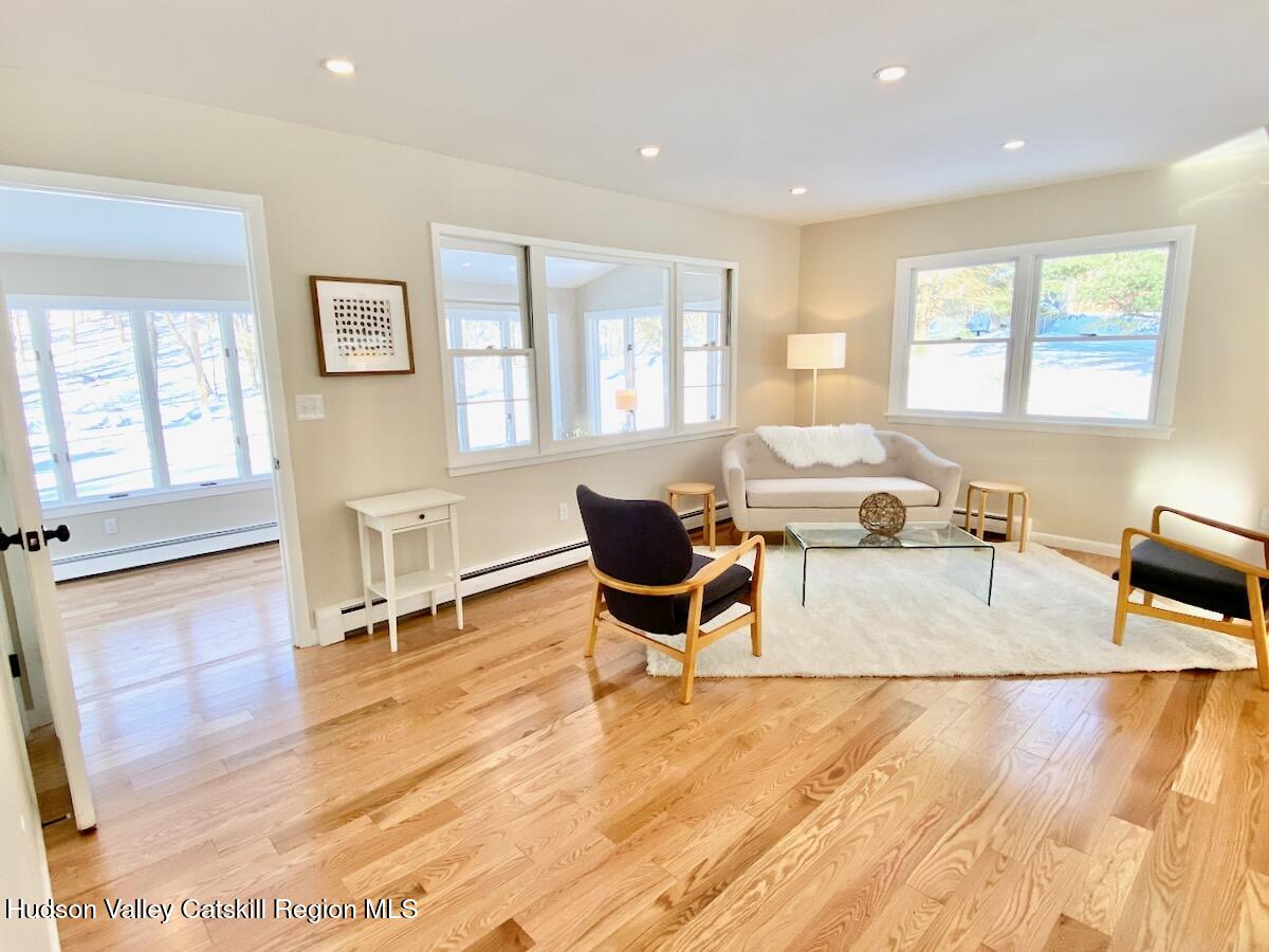 132 Weeds Mill Road Highland, NY 12528 - Photo 18 of 37 a living room with furniture and a wooden floor