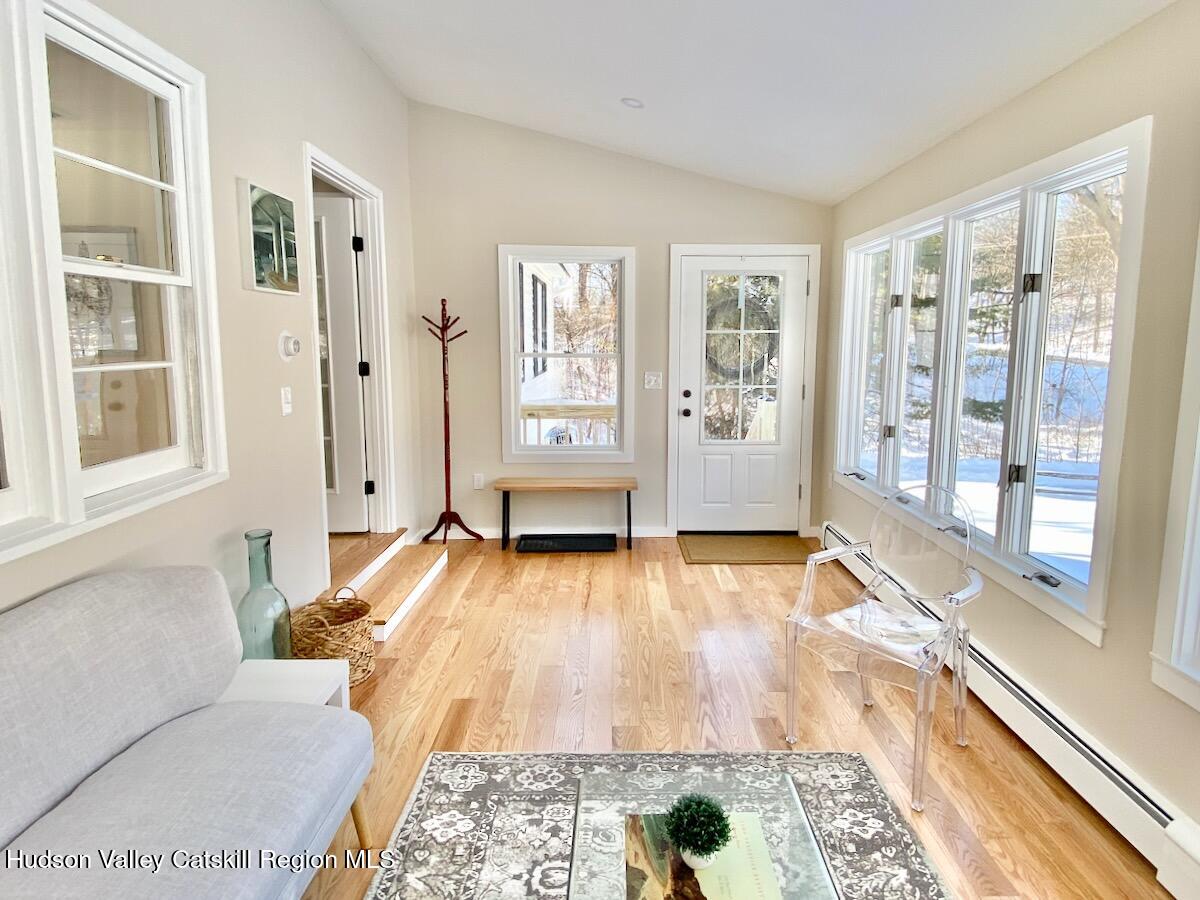 132 Weeds Mill Road Highland, NY 12528 - Photo 20 of 37 a view of an empty room with wooden floor and a window