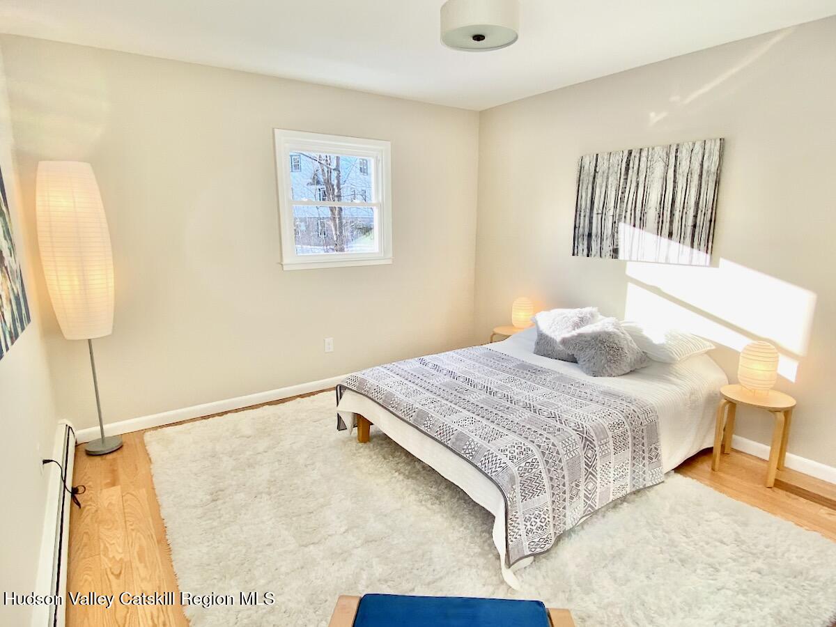 132 Weeds Mill Road Highland, NY 12528 - Photo 23 of 37 a bedroom with a bed and a painting on the wall