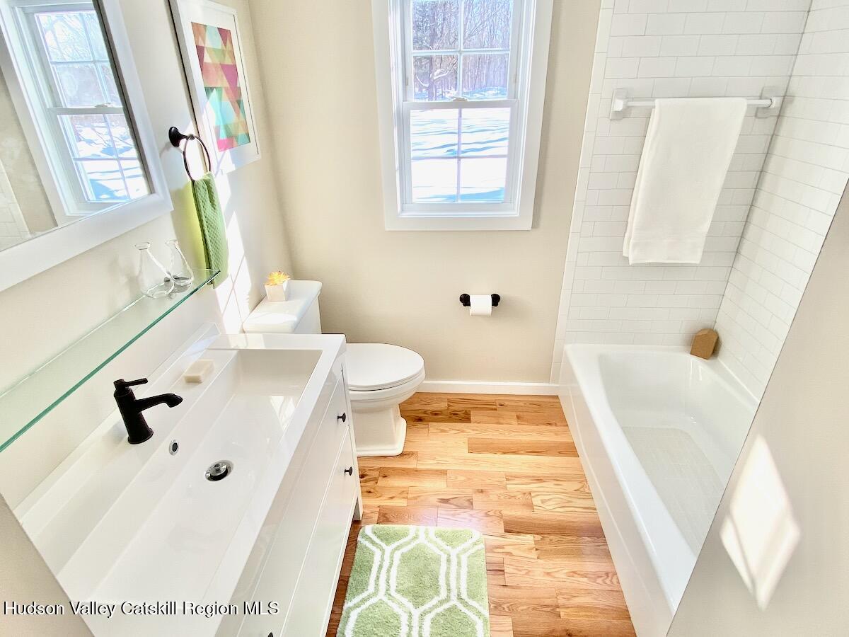 132 Weeds Mill Road Highland, NY 12528 - Photo 26 of 37 a bathroom with a sink and a tub
