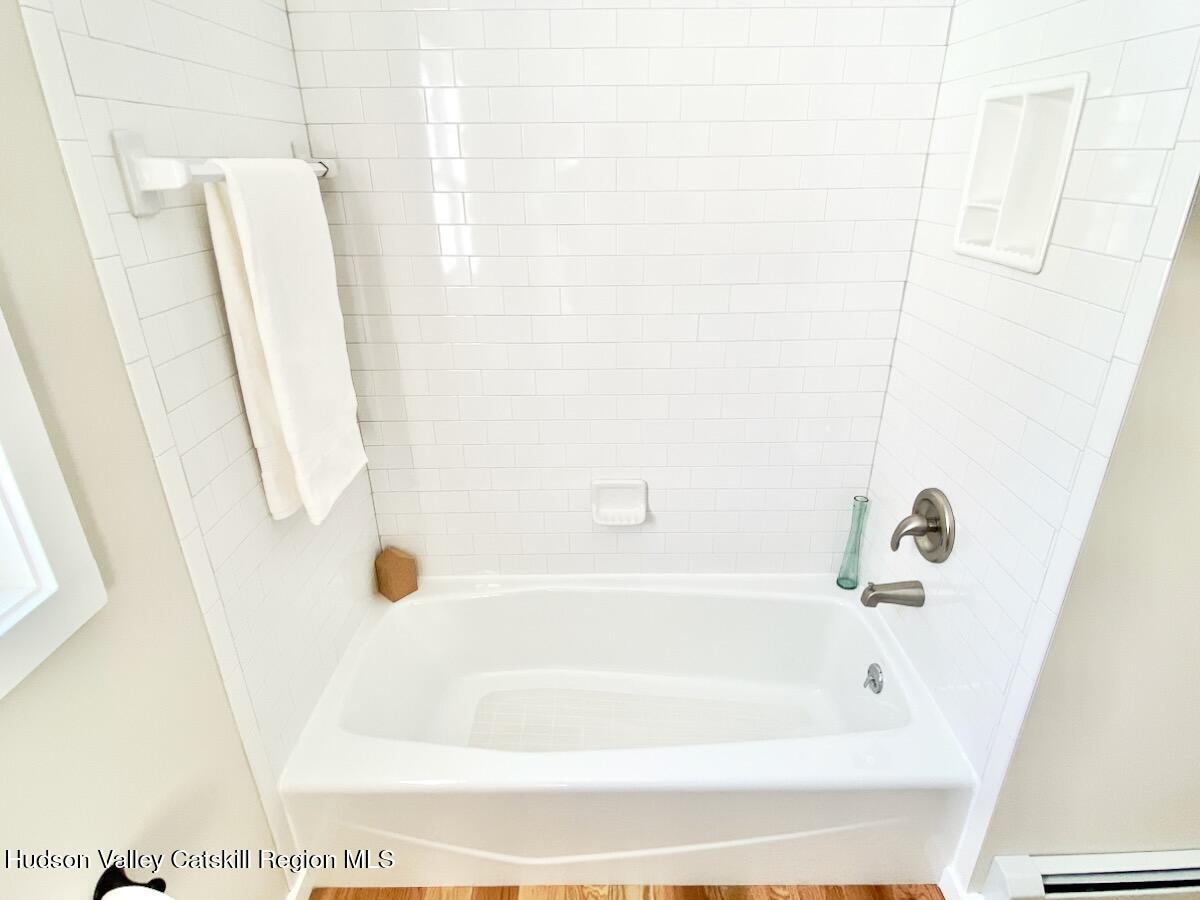 132 Weeds Mill Road Highland, NY 12528 - Photo 27 of 37 a bathroom with a bathtub and a shower