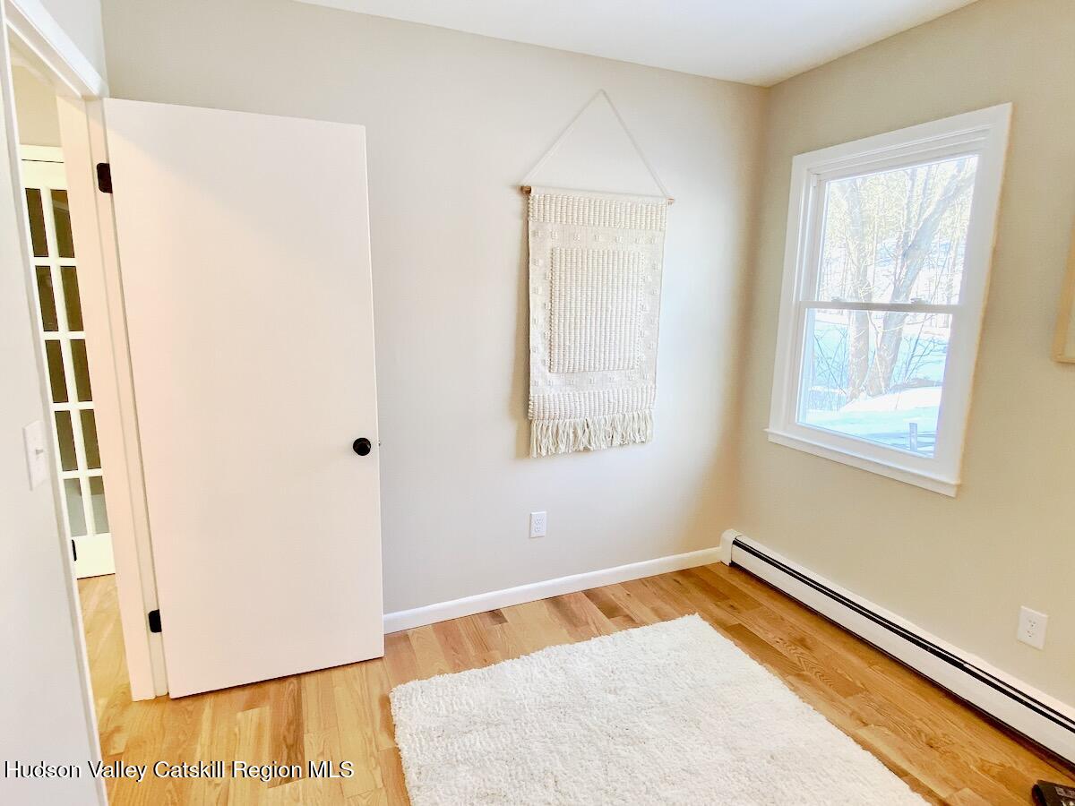 132 Weeds Mill Road Highland, NY 12528 - Photo 28 of 37 a view of a room with wooden floor and windows