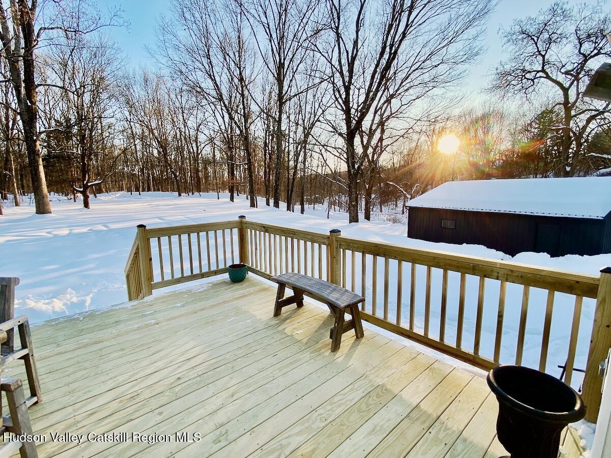 132 Weeds Mill Road Highland, NY 12528 - Photo 32 of 37 a view of a roof deck with wooden fence and trees