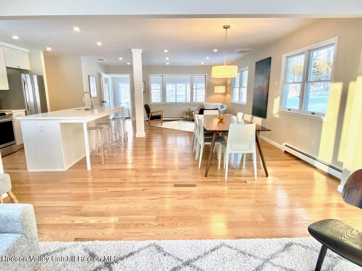 132 Weeds Mill Road Highland, NY 12528 - Photo 5 of 37 a living room with dining room and wooden floor