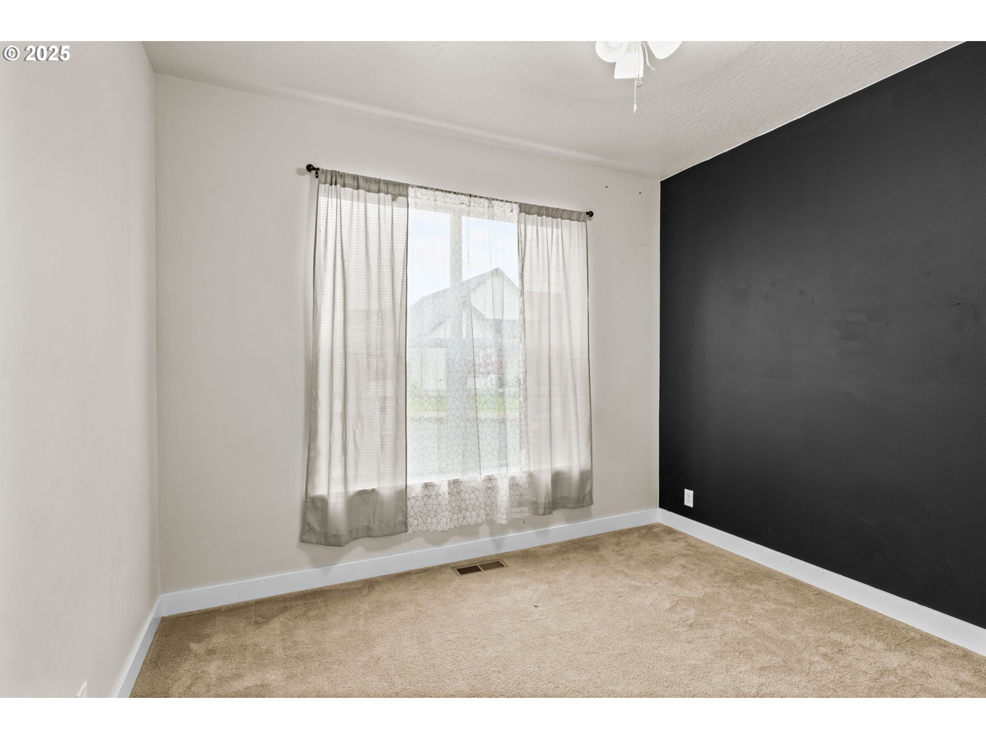1030 53rd Place Springfield, OR 97478 - Photo 29 of 39 an empty room with wooden floor and windows