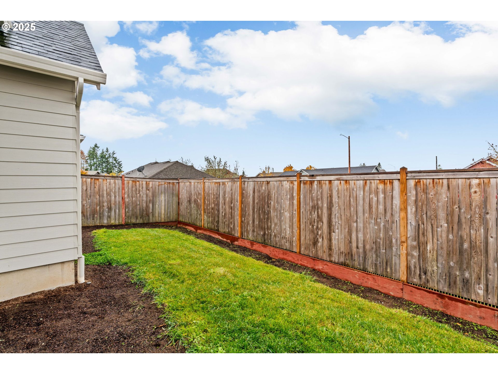 1030 53rd Place Springfield, OR 97478 - Photo 38 of 39 a view of a backyard with wooden fence