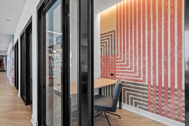 a living room with a fireplace and a flat screen tv