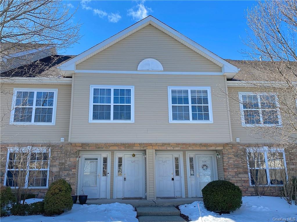 1036 Maggie Road, Unit 148 Newburgh, NY 12550 - Photo 1 of 1 a front view of a house with a yard