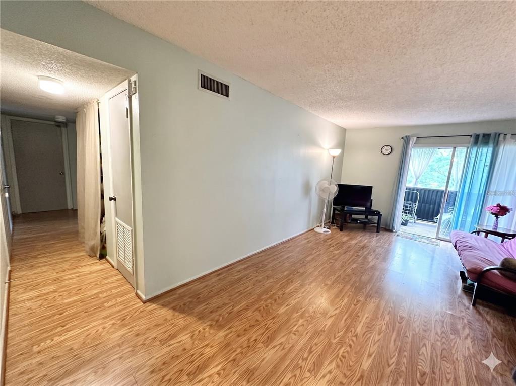 912 Lake Destiny Road, Unit F Altamonte Springs, FL 32714 - Photo 3 of 12 a view of livingroom with furniture and wooden floor